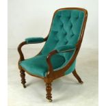 A Victorian mahogany open armchair with turned front supports and castors,