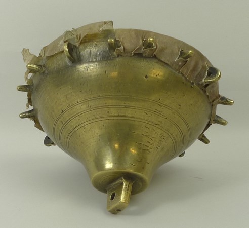 A 19th century brass falconer's drum, Near Eastern, of spoked inverted bell form with a skin cover, - Image 2 of 3