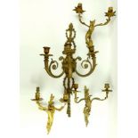 A group of gilt metal wall sconces, including a pair of twin branch sconces, 35cm high,