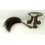 An Ethiopian Jima stool raised on three splayed feet carved from one piece of timber, 15cm high,