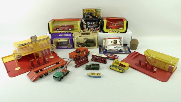 A quantity of Matchbox toys, including two garages, with cast metal Esso signs and petrol pumps,