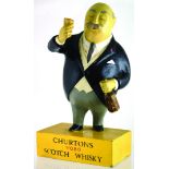 CHURTONS SCOTCH WHISKY ADVERTISING FIGURE. 10.25ins tall, rubberoid portly gent bottle & glass in