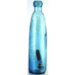 HOGBENS PATENT PALE BLUE GLASS BARRETTS STYLE BOTTLE. 9.25ins tall, with wooden stick stopper,