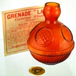 FRENCH FIRE GRENADE. 5.75ins tall, golden amber glass, spherical shape, embossed within circle s ‘