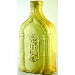 NOTTINGHAM SLAB SEAL FLASK. 7ins tall, grey/ green glaze, rectangular shape with round shoulders,