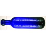 COBALT BLUE GLASS ROUND BOTTOMED CYLINDER. 9ins long, deep cobalt blue cylinder embossed ‘