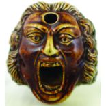 BELLOWING MAN INK. 2.25ins tall, 3ins long, variating tan & brown salt glaze in shape of a