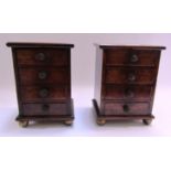 A pair of mahogany miniature four drawer