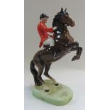 A Beswick huntsman on horseback, brown g
