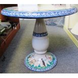 A Continental pottery garden table, the