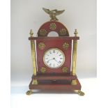 An Empire style mantel clock with eagle