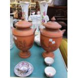 A pair of Torquay terracotta urns and co