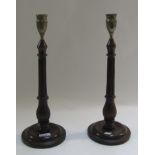 A pair of George III mahogany candlestic