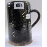 An English slipware mug, 18th century, o