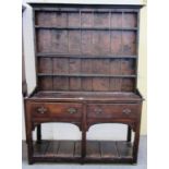 An 18th century oak dresser, the enclose