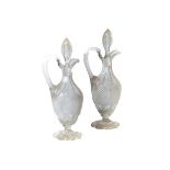 A pair of Victorian glass ewers and stop
