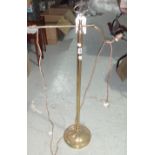 A brass adjustable standard lamp.