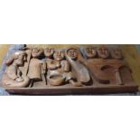 A large relief carved hardwood panel and