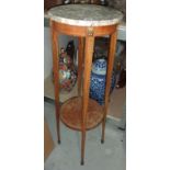 A marble top jardiniere stand.