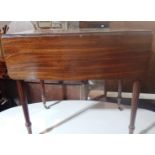 A Regency mahogany Pembroke table on flu