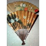 A similar pair of over-sized Chinese fan