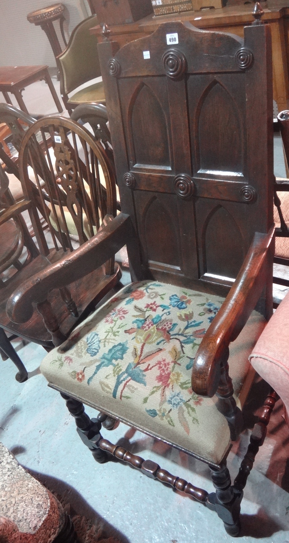 A 19th century oak open armchair with pa