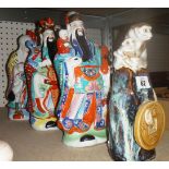 A group of three Oriental ceramic figure