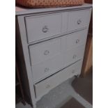 A grey painted chest of four long drawer