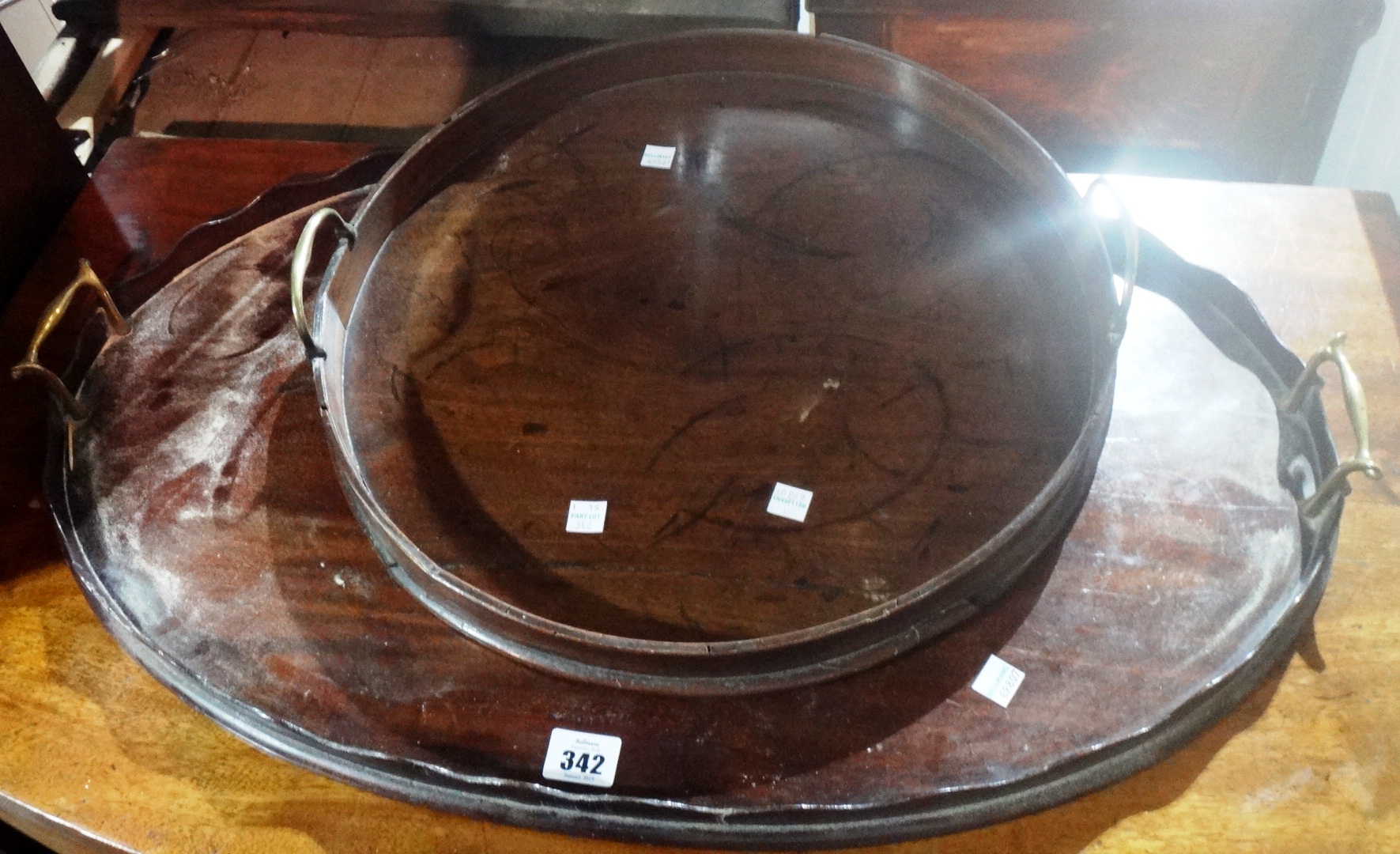 An 18th century mahogany circular tray,