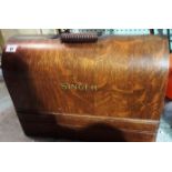 A 20th century oak cased Singer sewing m