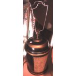 An ebonised gilt cylindrical table lamp