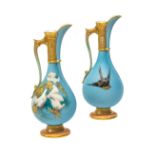 A pair of Royal Worcester small ewers by