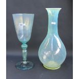 A large pale green wine glass with knopp