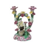 A French faience figural candlestick, 18