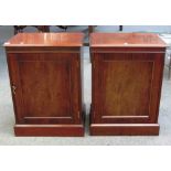 A pair of mahogany pedestal cupboards on plinth bases, 53cm wide.