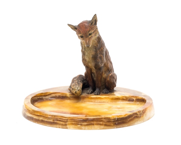 An Australian cold painted bronze fox, modelled seated atop a variegated marble vide poche of