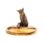 An Australian cold painted bronze fox, modelled seated atop a variegated marble vide poche of