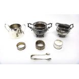 Silver, comprising; a twin handled sugar bowl and a matching milk jug, each with embossed