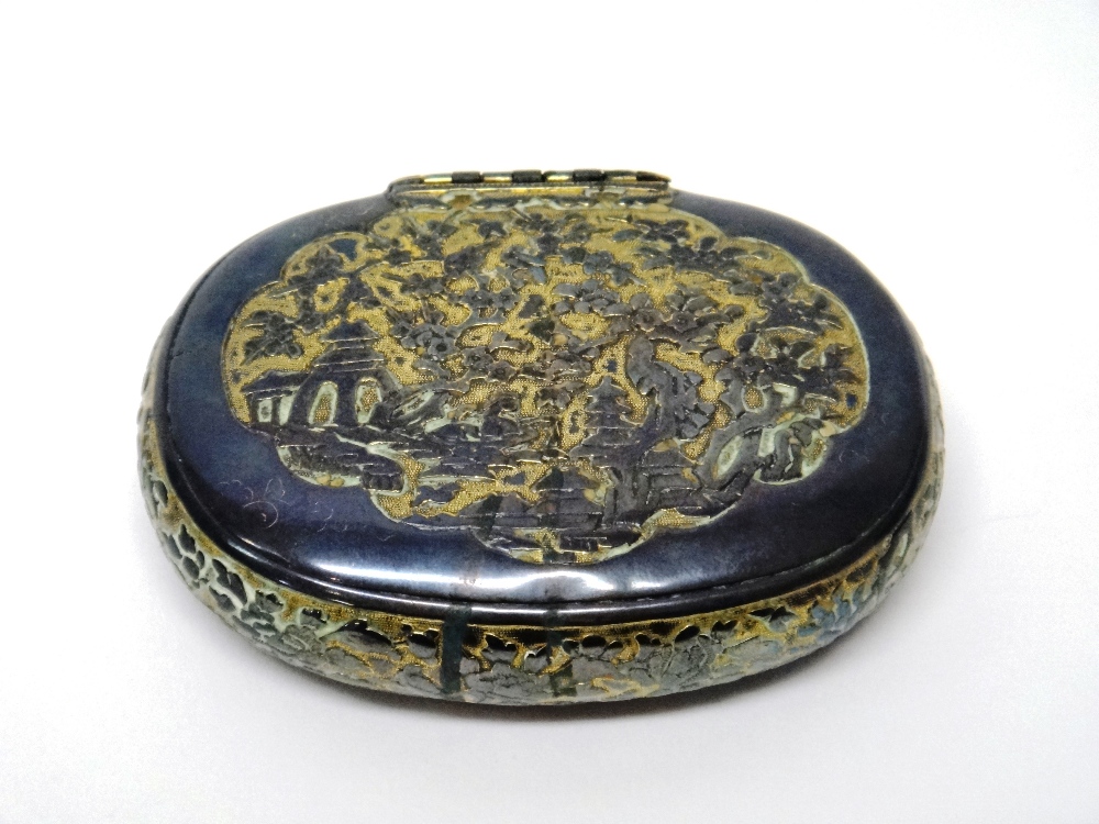 An Asian tonkin style parcel gilt oval hinge lidded box,