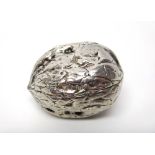 A late Victorian silver hinge lidded box, modelled as a walnut, London 1899, weight 29 gms,