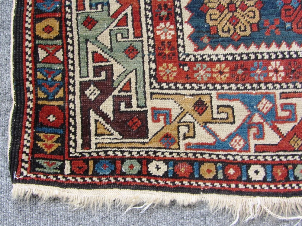 A Shirvan rug, Caucasian, the dark indigo field with three medallions supported by single Talish - Image 2 of 5