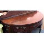 A George III mahogany bowfront sideboard with an arrangement of drawers and cupboards on tapering