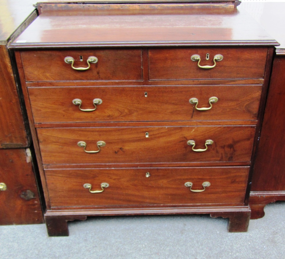 A George III mahogany chest of two short and three long drawers on bracket feet, 94cm wide.