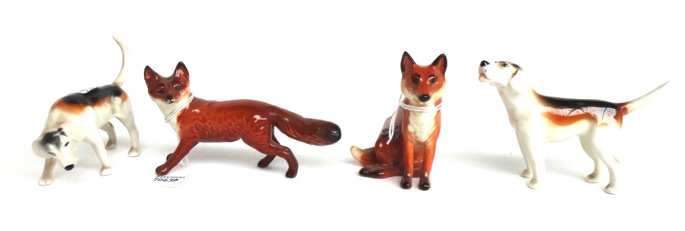 Five Beswick hounds (one a.f) and two Beswick foxes (7).