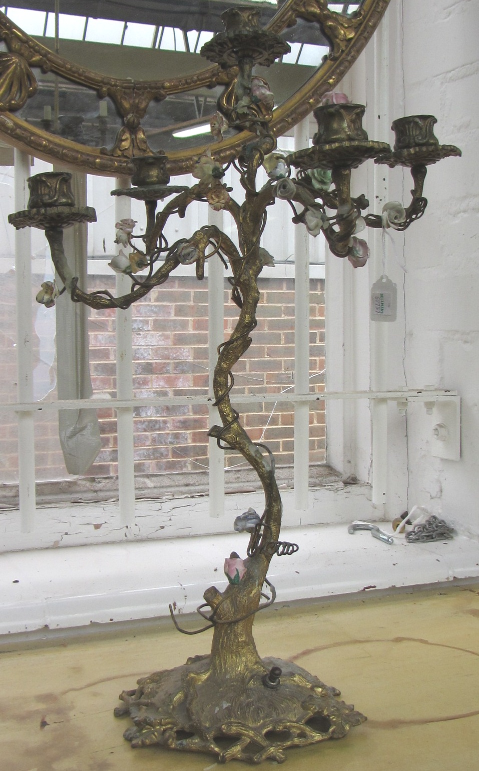 A gilt bronze five branch candelabra, early 20th century, the naturalistic tree base encrusted with