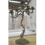 A gilt bronze five branch candelabra, early 20th century, the naturalistic tree base encrusted with