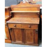 A 19th century oak ledge back chiffonier with pair of drawers over cupboard, on plinth base. 89cms