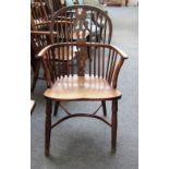 A George III yew and elm Windsor chair with pierced splat and turned supports.