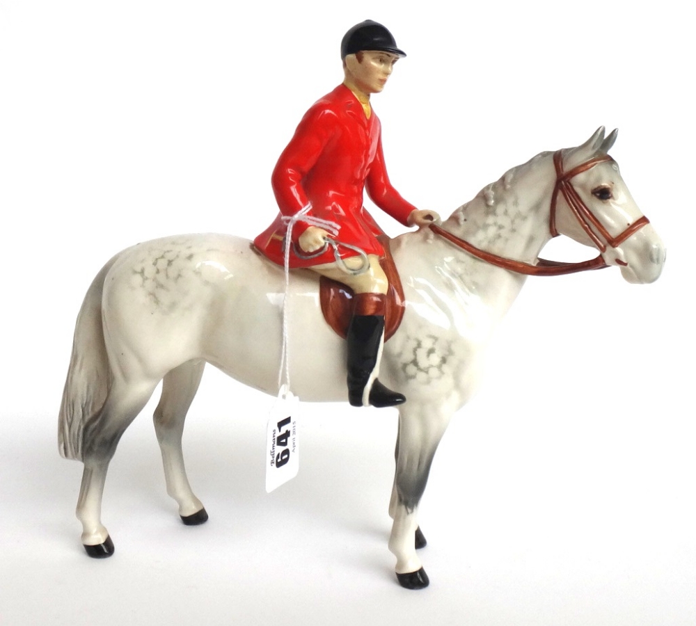 A Beswick huntsman on a dapple grey horse, No.1501, black printed mark.