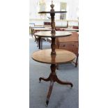 A George III mahogany circular three tier dumb waiter on tripod base, 70cm wide.